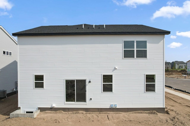 rear view of house with cooling unit