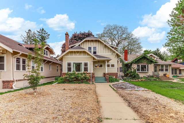 4228 Minnehaha Ave, Minneapolis, MN 55406 - view of front facade featuring stucco siding, a chimney, and brick siding