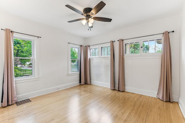 4228 Minnehaha Ave, Minneapolis, MN 55406 - empty room with plenty of natural light, light wood-style floors, and ceiling fan