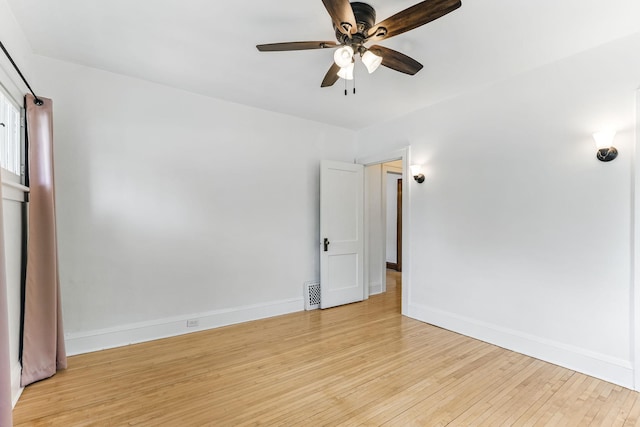 4228 Minnehaha Ave, Minneapolis, MN 55406 - empty room featuring light wood-type flooring, baseboards, and a ceiling fan