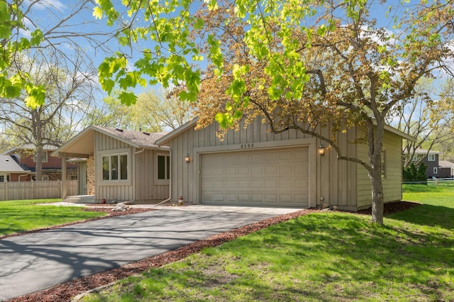 view of front of home with board and batten siding, concrete driveway, and a garage
