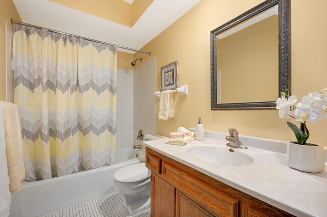 bathroom with toilet, shower / bathtub combination with curtain, vanity, and tile patterned floors