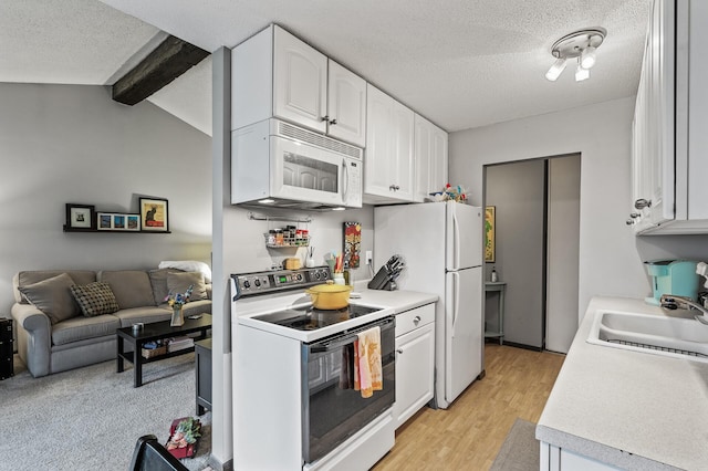 4500 Cedar Lake Rd S Unit 8, Saint Louis Park, MN 55416 - kitchen with white appliances, a sink, white cabinets, light countertops, and a textured ceiling