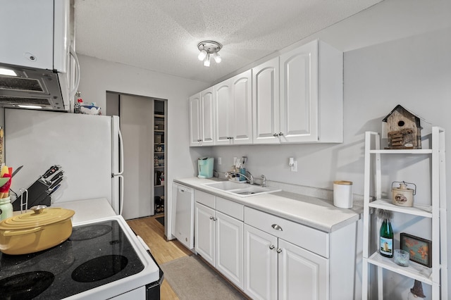 4500 Cedar Lake Rd S Unit 8, Saint Louis Park, MN 55416 - kitchen featuring white appliances, white cabinetry, light wood-style flooring, light countertops, and a textured ceiling