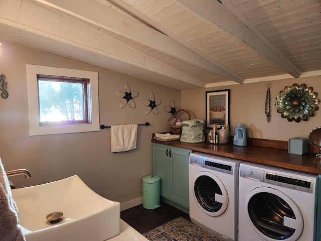 laundry room featuring dark wood-style floors, a sink, cabinet space, independent washer and dryer, and wood ceiling