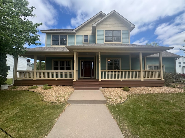11474 Laketowne Dr, Albertville, MN 55301 - view of front of property with covered porch, a shingled roof, and a front yard