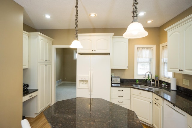 11474 Laketowne Dr, Albertville, MN 55301 - kitchen featuring white appliances, a sink, decorative light fixtures, dark stone counters, and recessed lighting