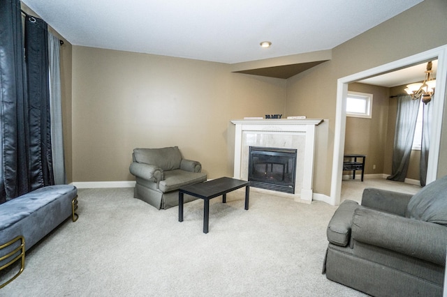 11474 Laketowne Dr, Albertville, MN 55301 - carpeted living room featuring baseboards, a premium fireplace, and a chandelier