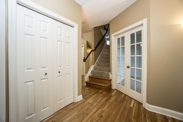 11474 Laketowne Dr, Albertville, MN 55301 - staircase with french doors, wood finished floors, and baseboards