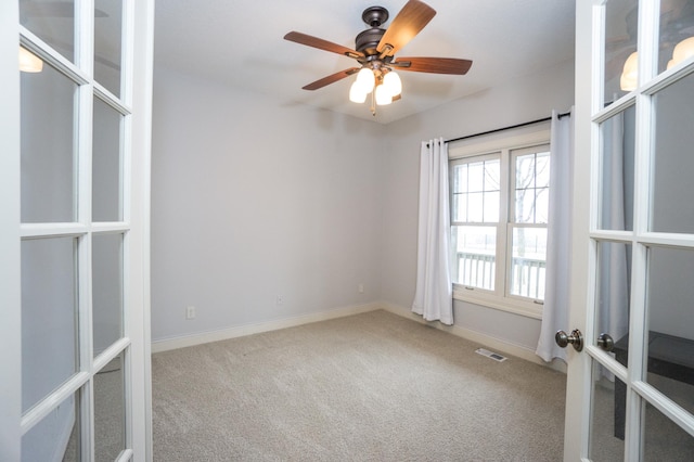 11474 Laketowne Dr, Albertville, MN 55301 - carpeted empty room featuring french doors, a ceiling fan, and baseboards