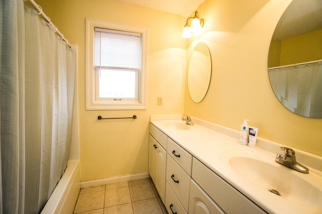11474 Laketowne Dr, Albertville, MN 55301 - full bath featuring double vanity, baseboards, tile patterned floors, and shower / bathtub combination with curtain