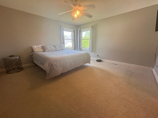 11474 Laketowne Dr, Albertville, MN 55301 - bedroom featuring light colored carpet, baseboards, a textured ceiling, and ceiling fan