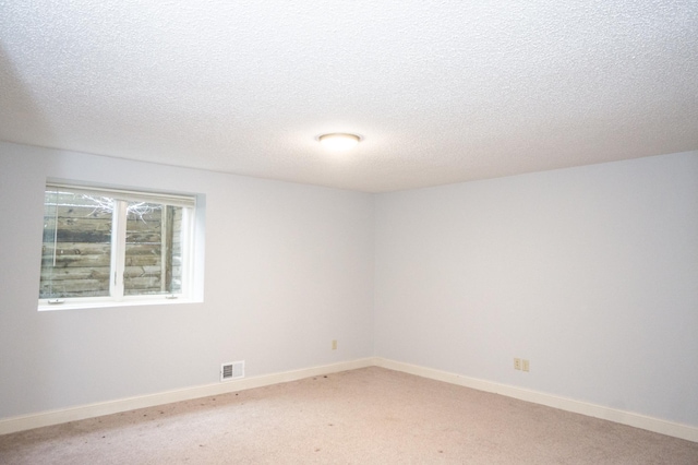 11474 Laketowne Dr, Albertville, MN 55301 - unfurnished room featuring light colored carpet, a textured ceiling, and baseboards