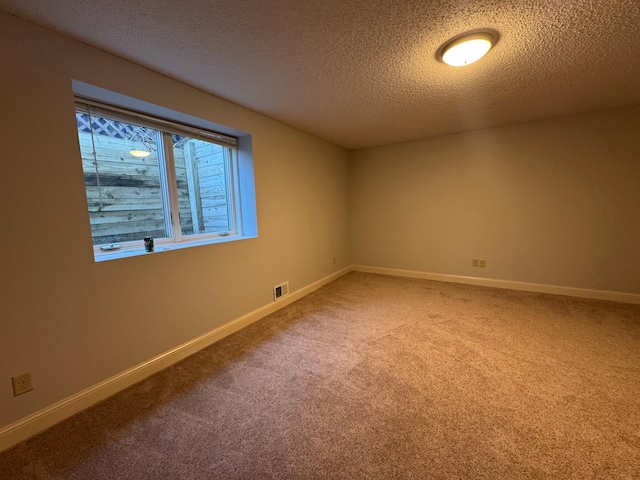11474 Laketowne Dr, Albertville, MN 55301 - unfurnished room featuring a textured ceiling, carpet flooring, and baseboards