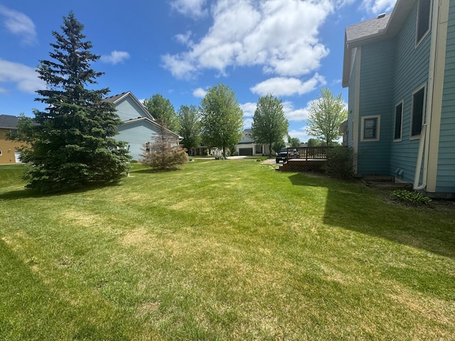 11474 Laketowne Dr, Albertville, MN 55301 - view of green lawn with a wooden deck