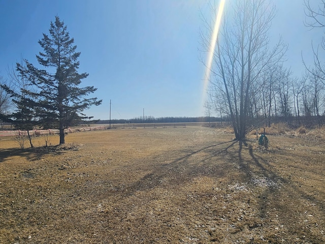 view of yard with a rural view