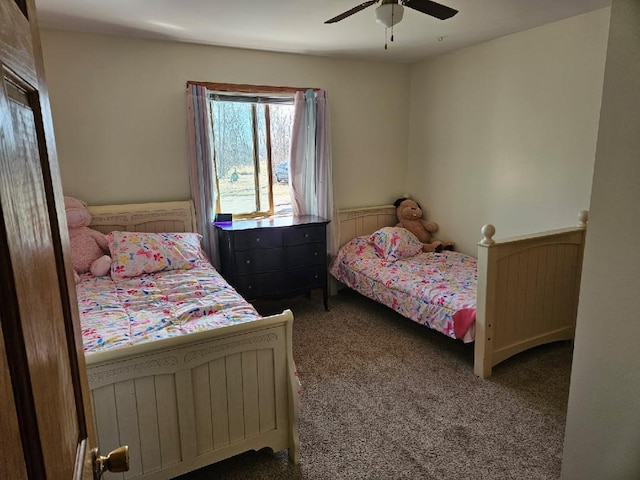 carpeted bedroom featuring a ceiling fan