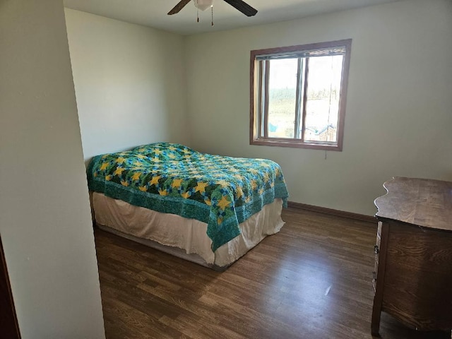 bedroom featuring wood finished floors, ceiling fan, and baseboards