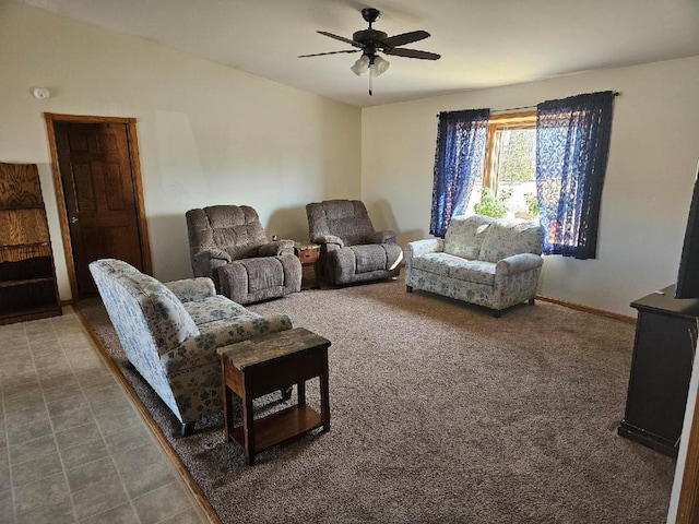 living area with baseboards, a ceiling fan, and carpet floors