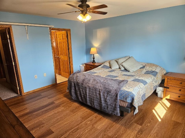 bedroom with a ceiling fan and wood finished floors
