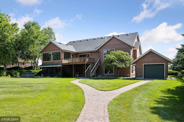 back of house featuring a lawn, driveway, a deck, and stairway