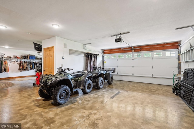 garage featuring a garage door opener