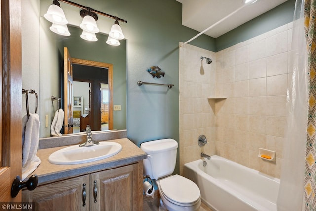 full bathroom featuring toilet, vanity, and shower / bathing tub combination