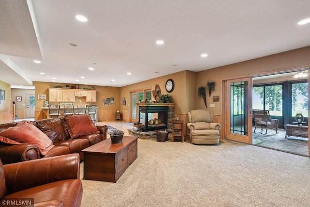 living area with light carpet, a fireplace, and recessed lighting
