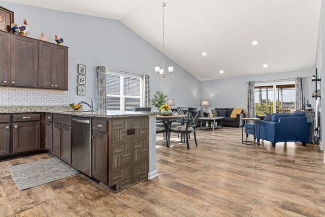 10120 189th Ave NW, Elk River, MN 55330 - kitchen featuring stainless steel dishwasher, dark brown cabinets, open floor plan, a peninsula, and recessed lighting