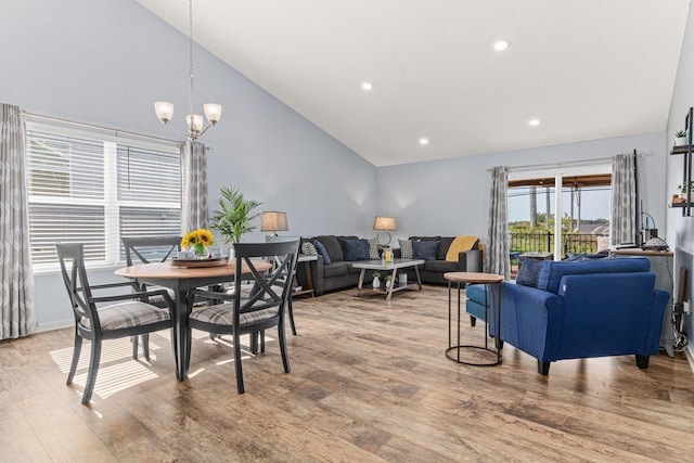 10120 189th Ave NW, Elk River, MN 55330 - dining area with wood finished floors, a chandelier, recessed lighting, and high vaulted ceiling