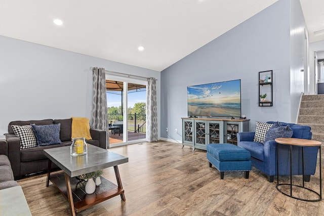 10120 189th Ave NW, Elk River, MN 55330 - living room with vaulted ceiling, wood finished floors, recessed lighting, stairs, and baseboards