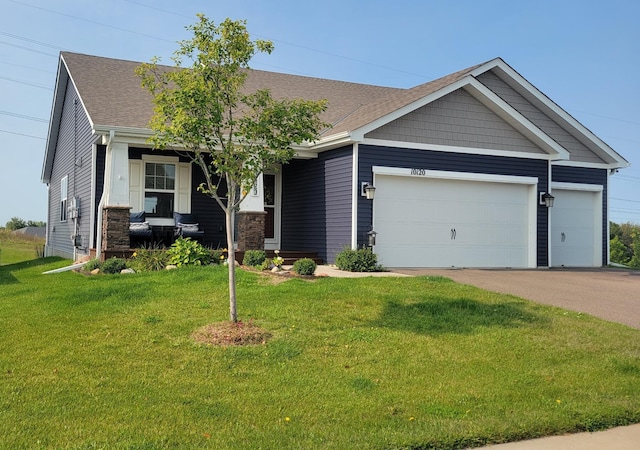 10120 189th Ave NW, Elk River, MN 55330 - craftsman-style home with a garage, a front lawn, a shingled roof, driveway, and covered porch