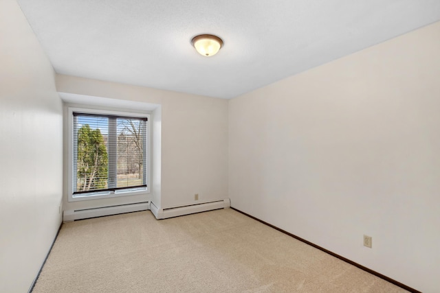 450 Ford Rd Unit 225, Saint Louis Park, MN 55426 - spare room with light colored carpet and a baseboard heating unit