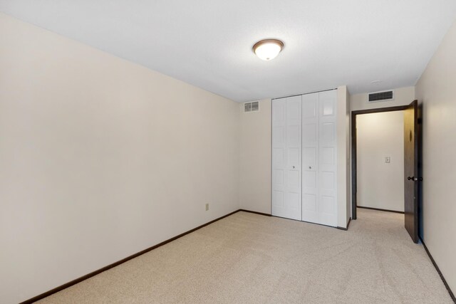 450 Ford Rd Unit 225, Saint Louis Park, MN 55426 - unfurnished bedroom with light colored carpet and a closet