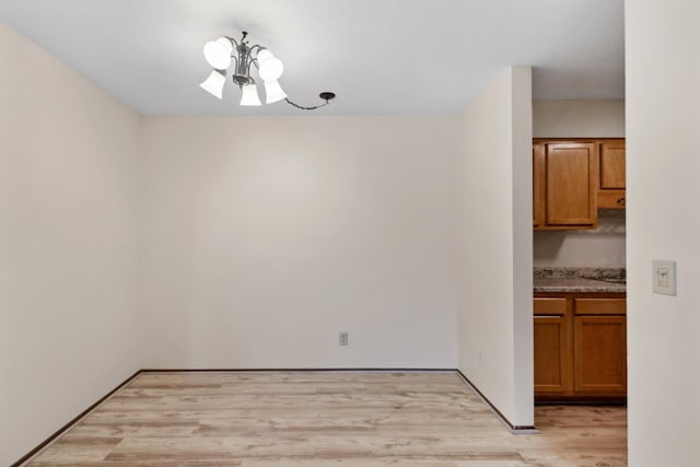450 Ford Rd Unit 225, Saint Louis Park, MN 55426 - unfurnished dining area featuring a chandelier and light wood finished floors