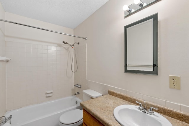 450 Ford Rd Unit 225, Saint Louis Park, MN 55426 - bathroom featuring vanity,  shower combination, a textured ceiling, and tile walls