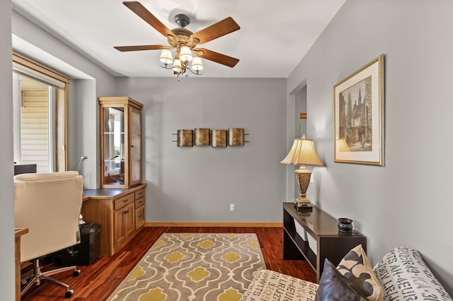 home office with ceiling fan, dark wood-style flooring, and baseboards