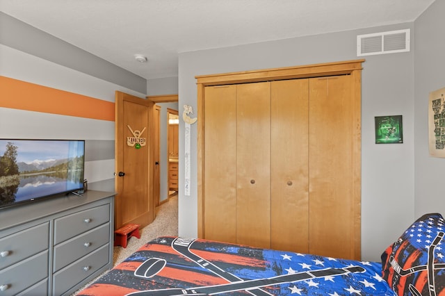 bedroom with a closet and carpet