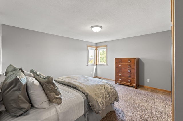 carpeted bedroom featuring baseboards
