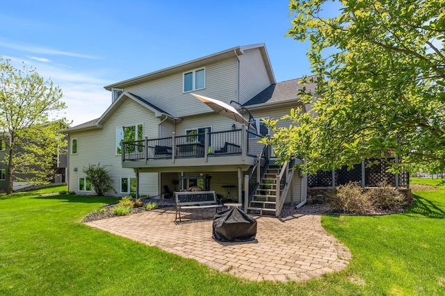 back of house featuring a patio, stairway, an outdoor fire pit, a deck, and a lawn