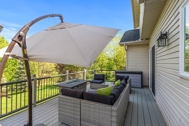 wooden terrace featuring an outdoor living space and a yard