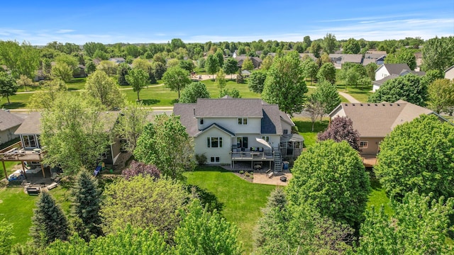 aerial perspective of suburban area with a tree filled landscape