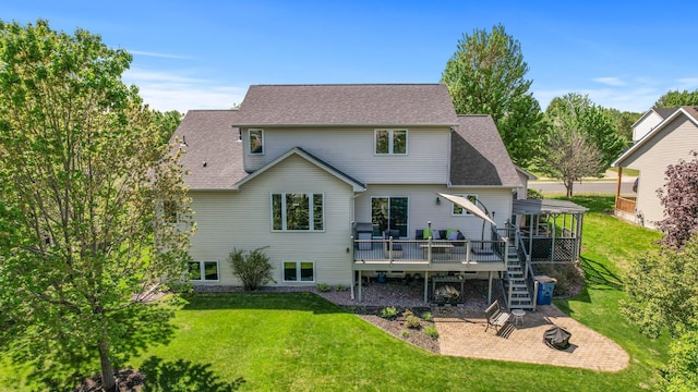 back of house featuring a wooden deck, stairway, a lawn, and a patio area