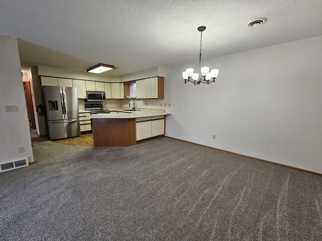 21965 Shady Walk Unit 201, Deerwood, MN 56444 - kitchen featuring visible vents, a notable chandelier, a sink, and stainless steel appliances
