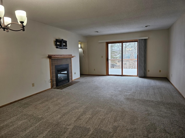 21965 Shady Walk Unit 201, Deerwood, MN 56444 - unfurnished living room with a notable chandelier, a textured ceiling, a tile fireplace, and carpet
