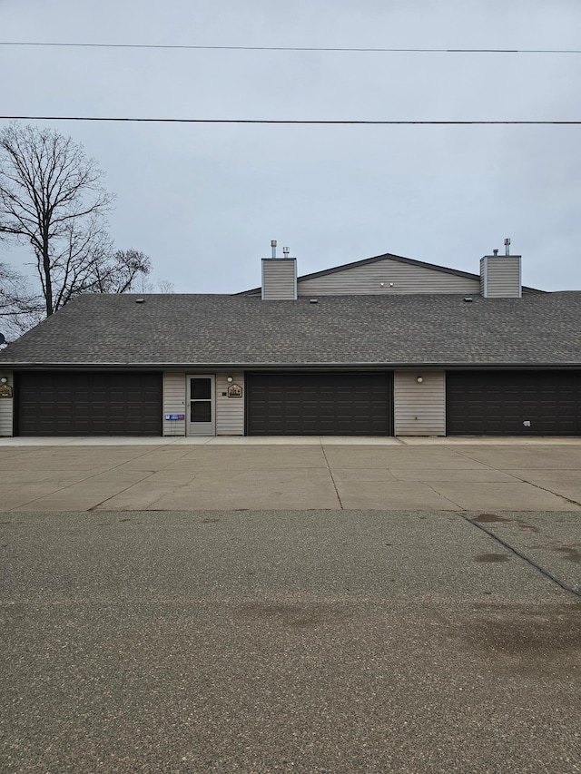 21965 Shady Walk Unit 201, Deerwood, MN 56444 - view of front of home with roof with shingles and a chimney