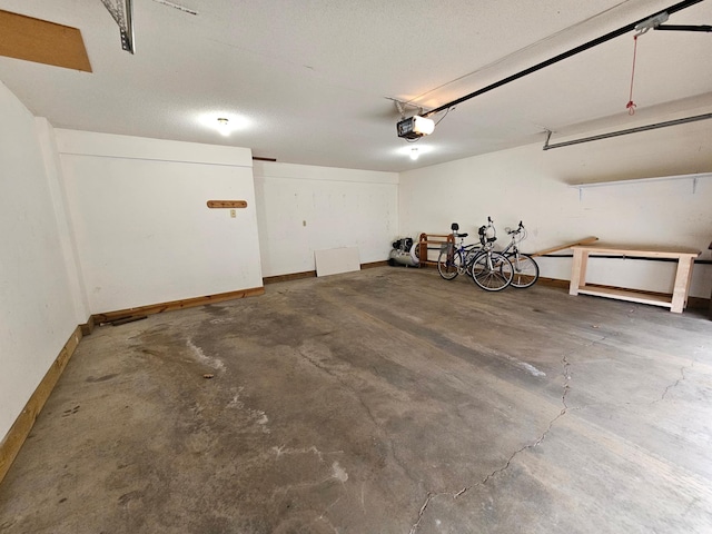 21965 Shady Walk Unit 201, Deerwood, MN 56444 - garage featuring baseboards and a garage door opener