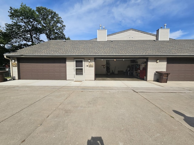 21965 Shady Walk Unit 201, Deerwood, MN 56444 - view of front facade with a chimney, a shingled roof, and a garage