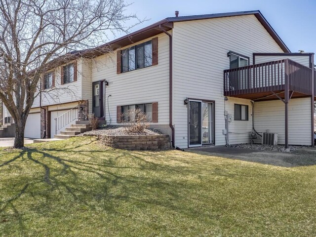 15722 Griffon Ct, Apple Valley, MN 55124 - rear view of house with a lawn and an attached garage