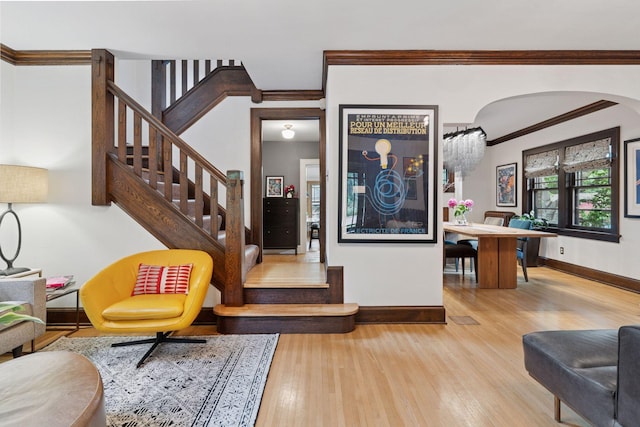 1295 Fairmount Ave, Saint Paul, MN 55105 - foyer with arched walkways, wood finished floors, ornamental molding, and stairs